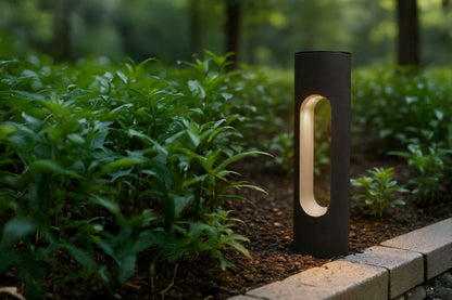 Modern outdoor solar garden light fixture in a natural setting